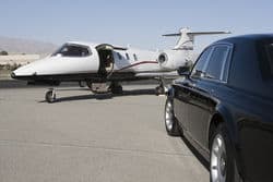 stock photo limousine and private jet on landing strip 119204140